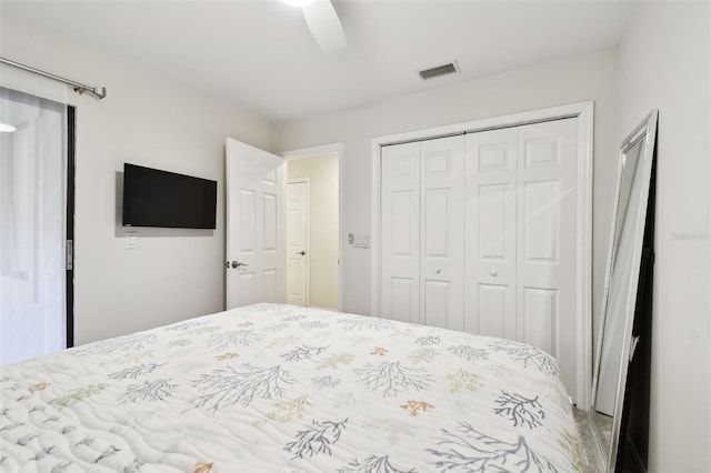 bedroom featuring ceiling fan and a closet