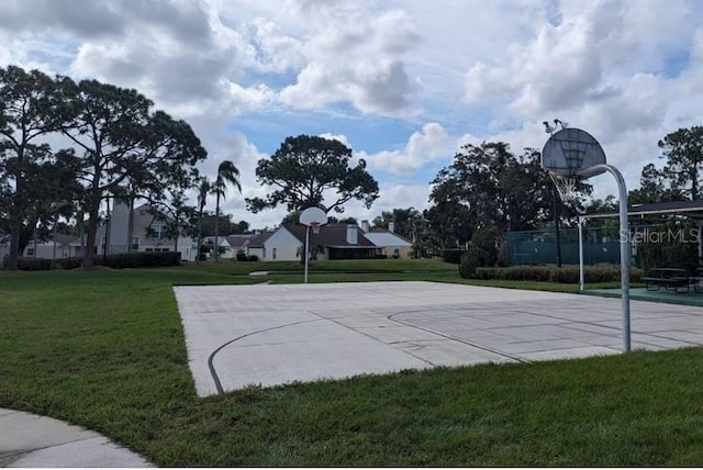 view of basketball court featuring a lawn