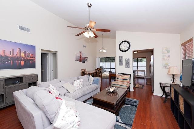 living room featuring ceiling fan, dark hardwood / wood-style flooring, and high vaulted ceiling