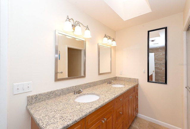 bathroom with vanity and a skylight