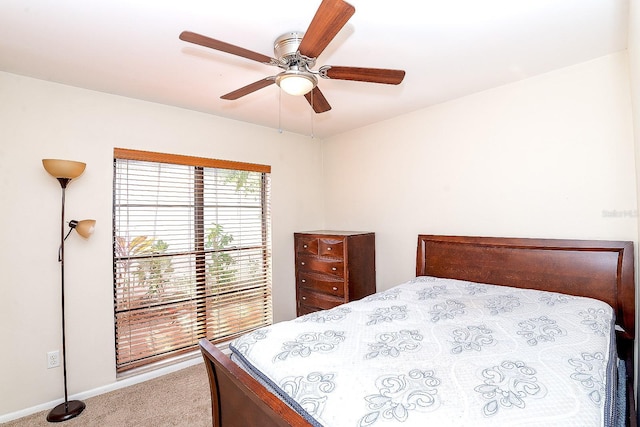 bedroom with ceiling fan and carpet floors