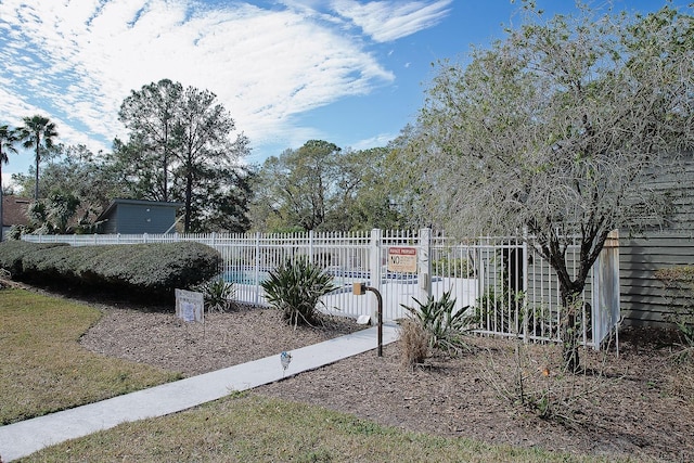 view of yard with a fenced in pool