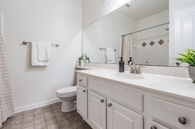 bathroom with vanity, toilet, and walk in shower