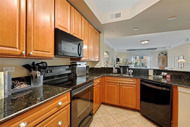 kitchen with sink, light tile patterned floors, dark stone countertops, ornamental molding, and black appliances