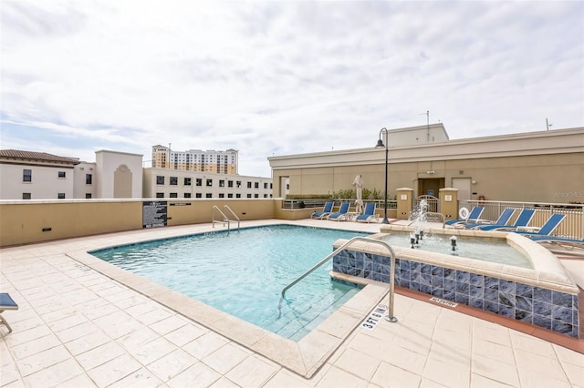 view of swimming pool with a patio area and pool water feature