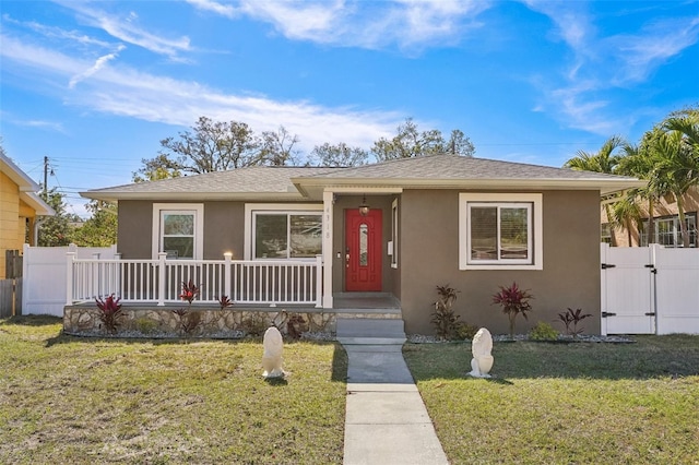 bungalow-style house with a front yard and a porch