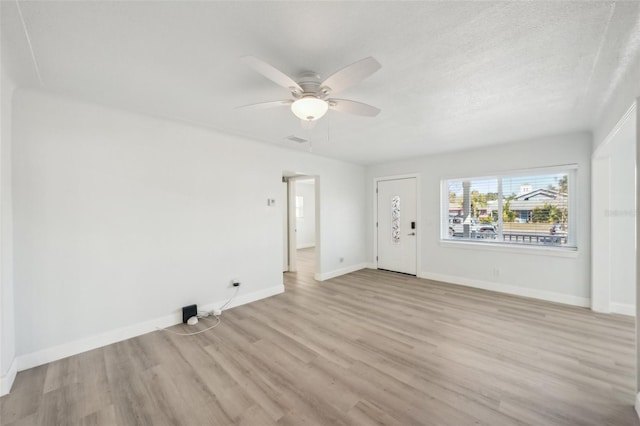 interior space with light hardwood / wood-style flooring and ceiling fan