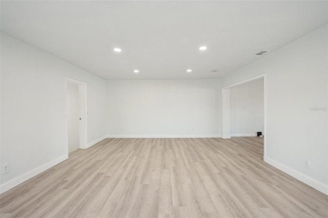 unfurnished room with light wood-type flooring