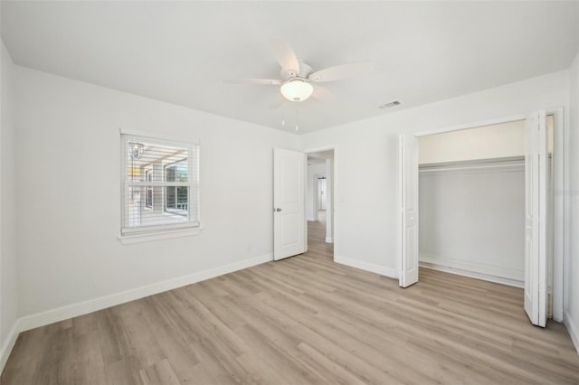 unfurnished bedroom with a closet, ceiling fan, and light wood-type flooring