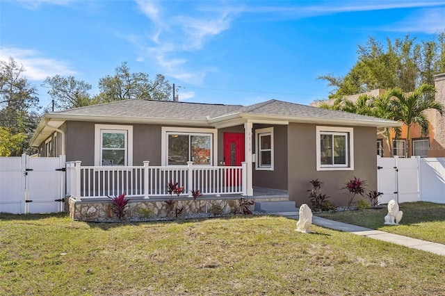 view of front of property with a front yard and a porch