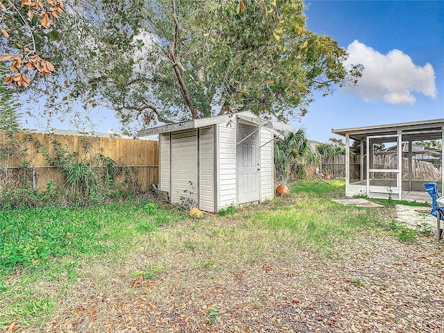 view of shed with a fenced backyard