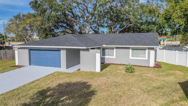 ranch-style home featuring a garage and a front yard