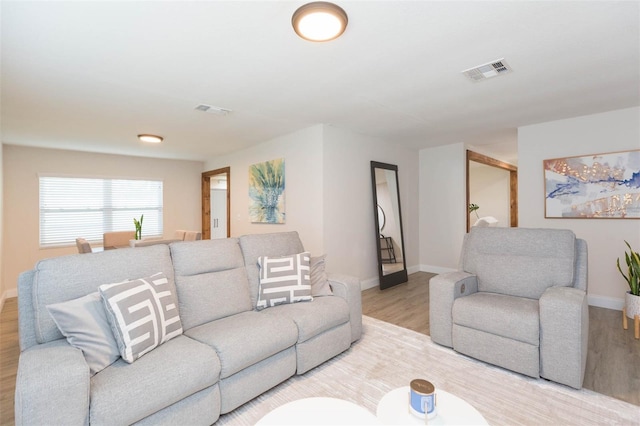 living room with light hardwood / wood-style floors