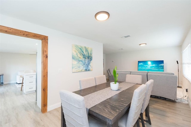 dining area with light wood-type flooring