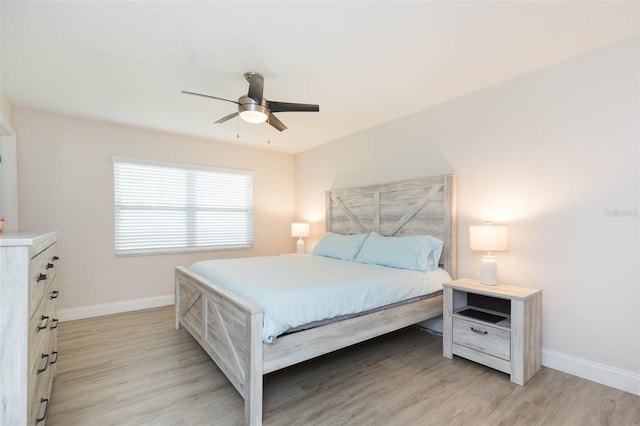 bedroom featuring ceiling fan and light hardwood / wood-style floors