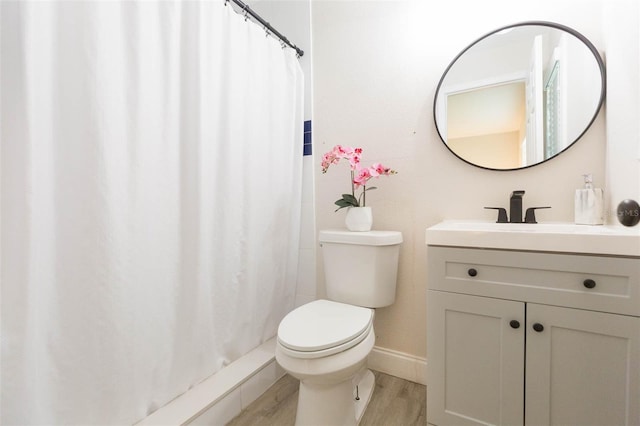 bathroom with vanity, toilet, a shower with shower curtain, and wood-type flooring