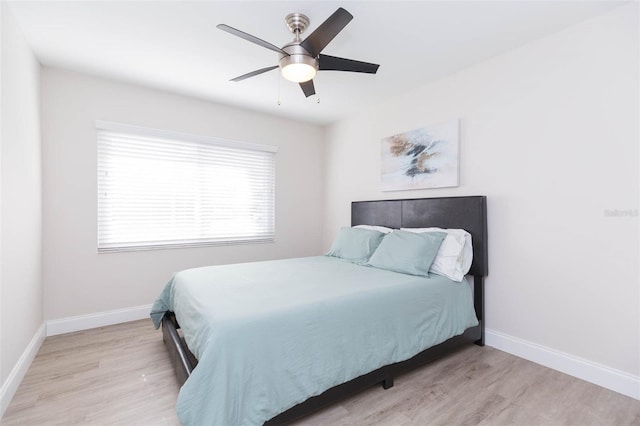 bedroom featuring ceiling fan and light wood-type flooring