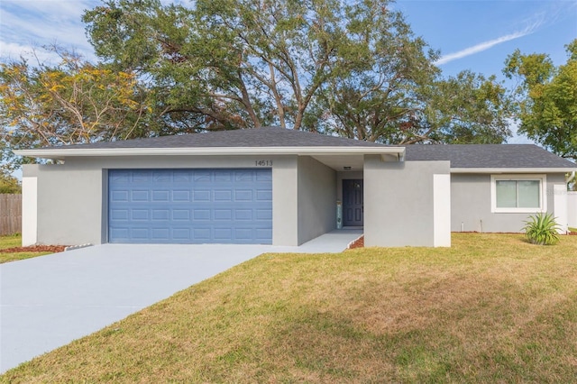 single story home with a garage and a front yard