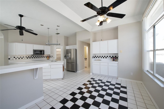 kitchen featuring white cabinetry, sink, decorative backsplash, and stainless steel appliances