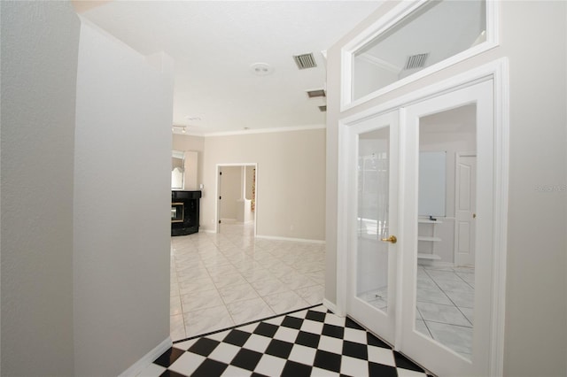 corridor featuring ornamental molding and french doors