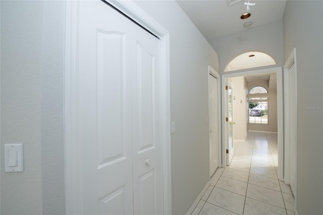 corridor featuring light tile patterned floors