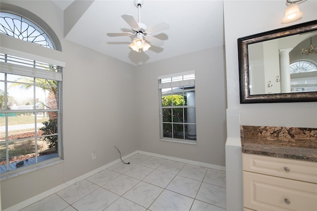 interior space with a wealth of natural light and ceiling fan