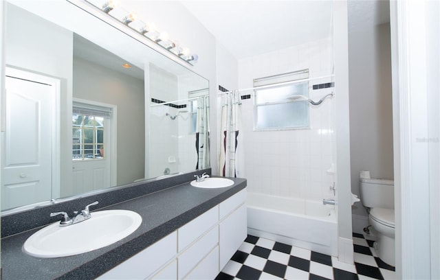 full bathroom featuring vanity, toilet, and shower / tub combo