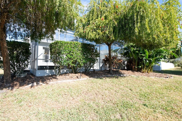 view of yard with a lanai