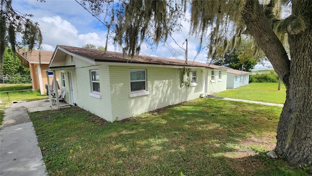 view of home's exterior featuring a yard