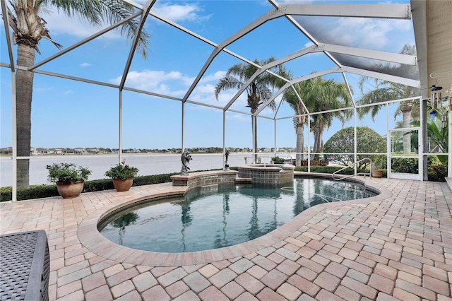 view of pool with an in ground hot tub, a patio, a water view, and glass enclosure