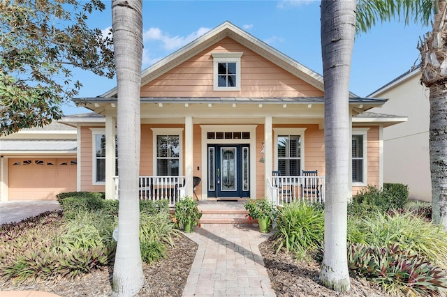 view of front facade with a garage and a porch