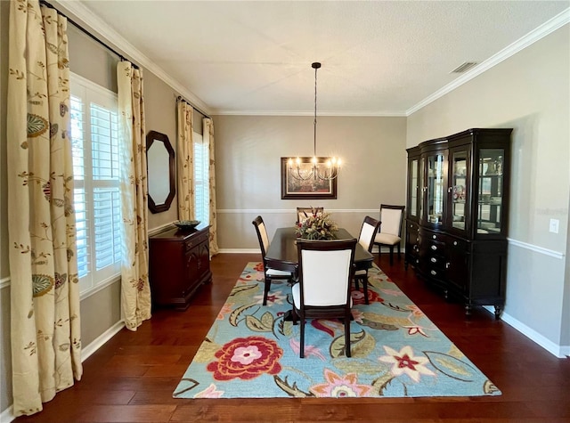 dining area with crown molding, dark hardwood / wood-style flooring, and a notable chandelier