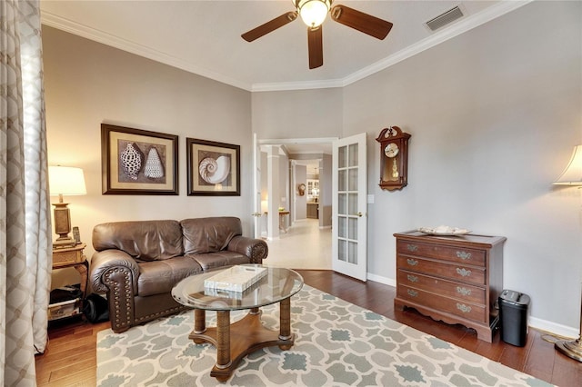 living room featuring french doors, ceiling fan, ornamental molding, and dark hardwood / wood-style flooring