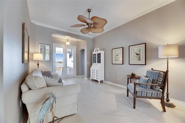 living room featuring french doors, ceiling fan, ornamental molding, and light tile patterned floors