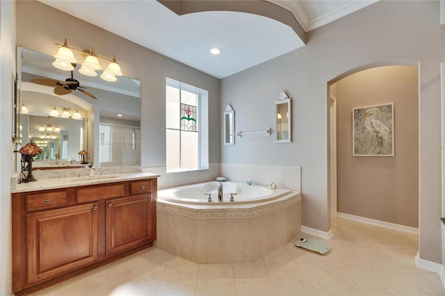 bathroom featuring tile patterned flooring, vanity, independent shower and bath, and ornamental molding