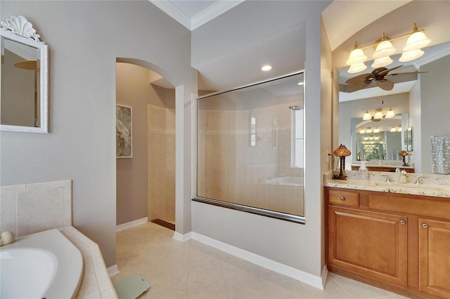 bathroom with crown molding, vanity, shower with separate bathtub, and tile patterned flooring