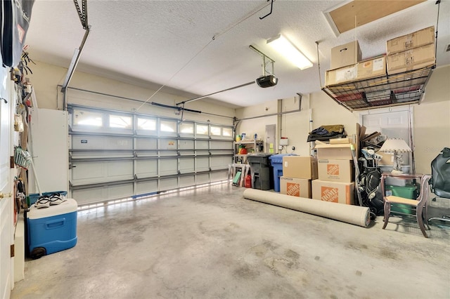 garage featuring a garage door opener and electric panel