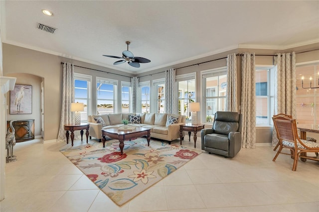 interior space with ornamental molding and ceiling fan