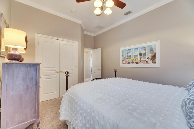 bedroom with ceiling fan, a closet, ornamental molding, and light carpet