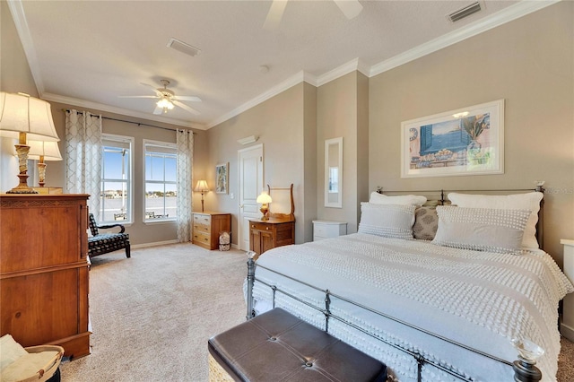 carpeted bedroom with crown molding and ceiling fan