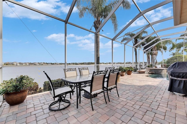 view of patio featuring a water view, area for grilling, and a lanai