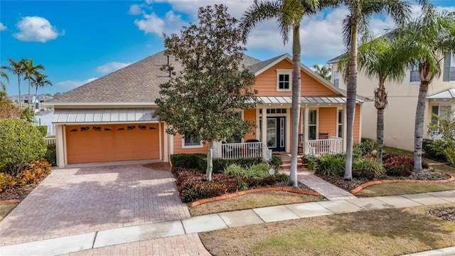 view of front of home with a garage and covered porch