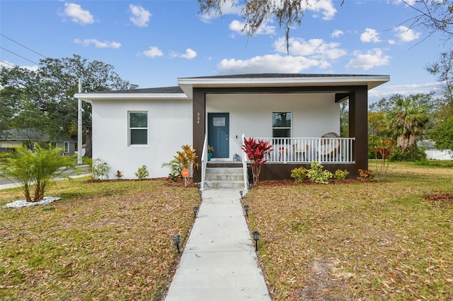 view of front facade featuring a porch and a front yard