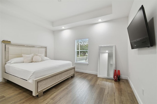 bedroom with wood-type flooring