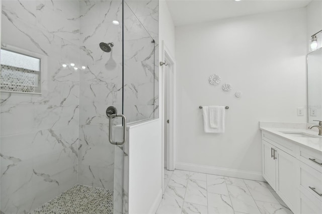 bathroom featuring vanity and a shower with door