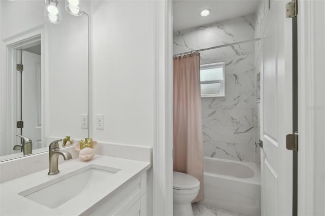 full bathroom with vanity, shower / bath combo, and toilet