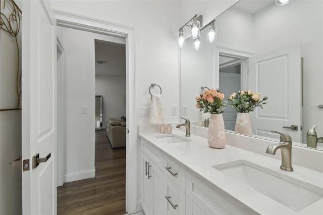 bathroom with vanity and hardwood / wood-style floors