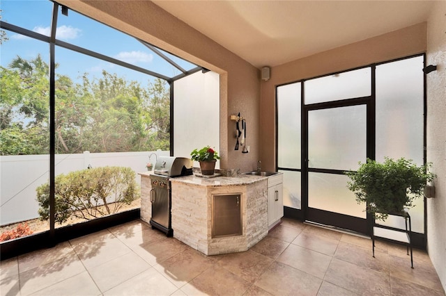 sunroom / solarium with sink and a wealth of natural light