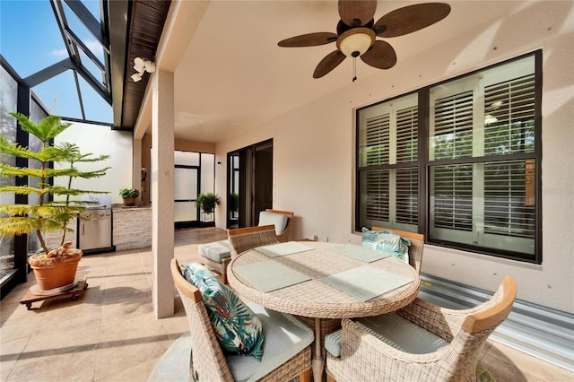 view of patio featuring a lanai, grilling area, and ceiling fan