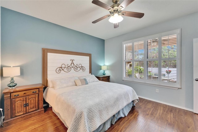 bedroom with hardwood / wood-style flooring and ceiling fan